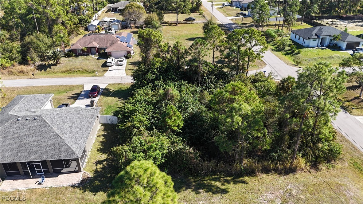 800 West 9th Street Lehigh Acres, FL 33972 - Photo 3 of 14 a aerial view of a house with a yard and lake view