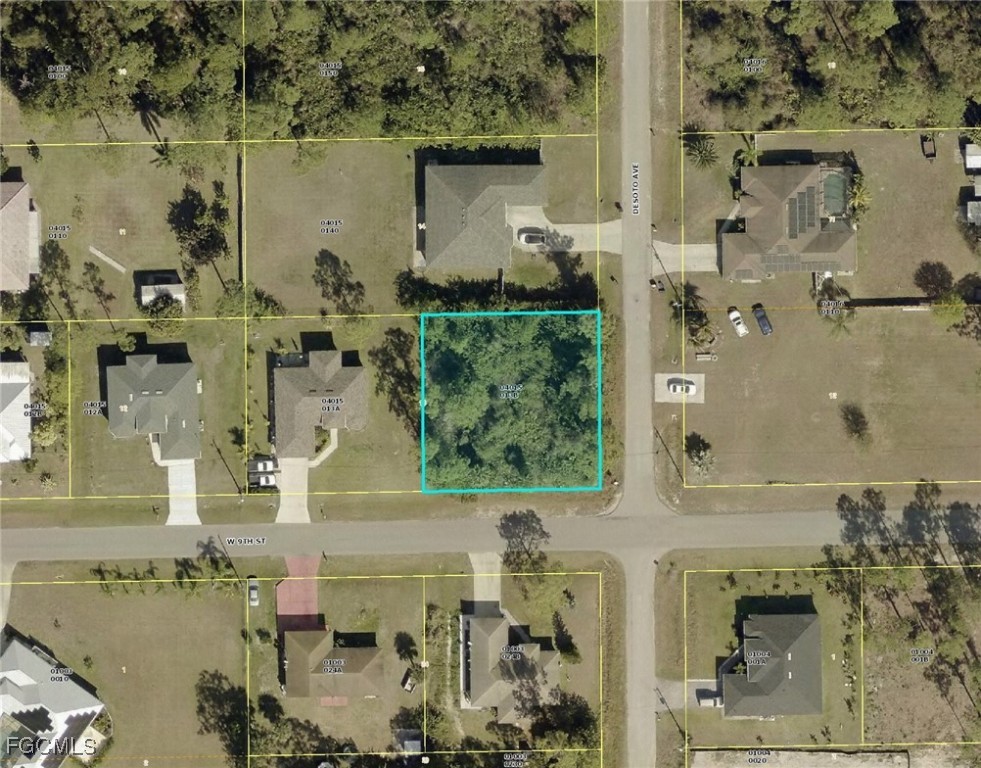 800 West 9th Street Lehigh Acres, FL 33972 - Photo 9 of 14 an aerial view of residential houses with outdoor space