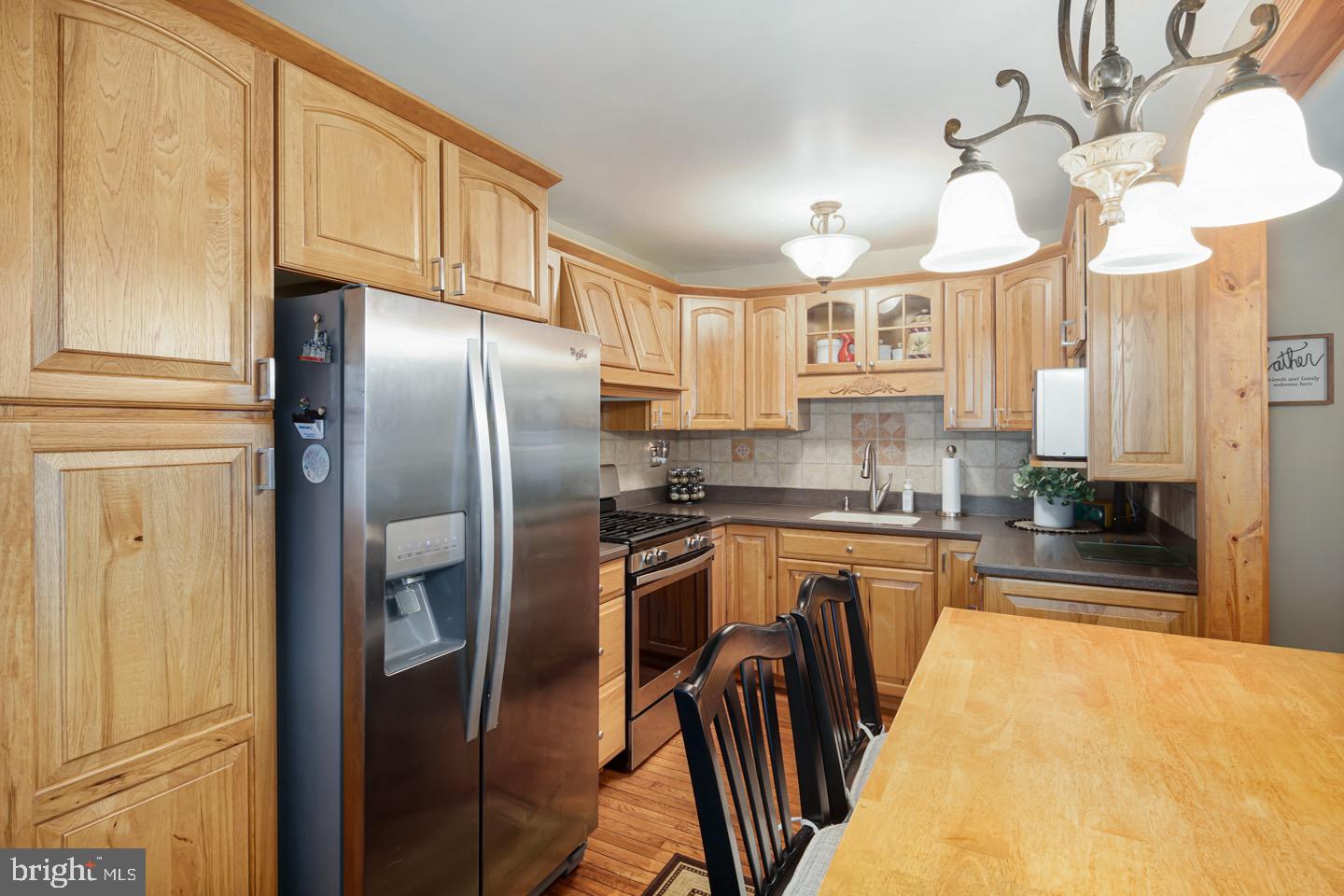 12482 Balston Road Philadelphia, PA 19154 - Photo 13 of 30 a kitchen with stainless steel appliances granite countertop a refrigerator a stove top oven a sink and dishwasher