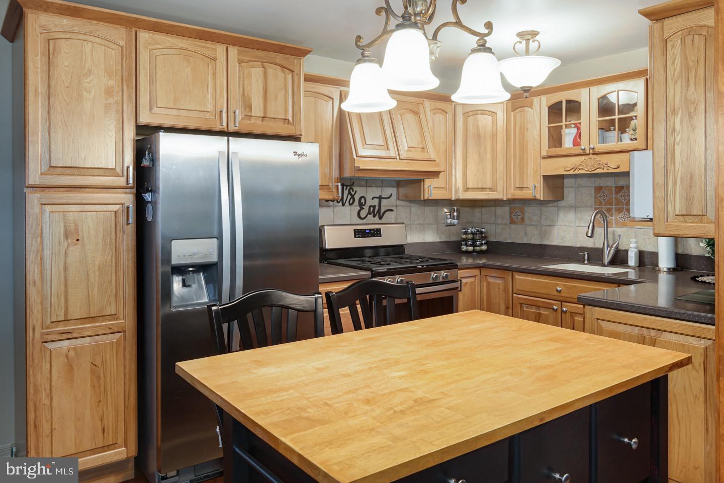 12482 Balston Road Philadelphia, PA 19154 - Photo 14 of 30 a kitchen with stainless steel appliances granite countertop a sink refrigerator and cabinets