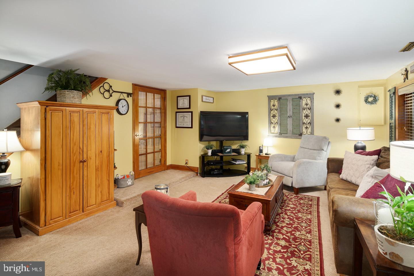 12482 Balston Road Philadelphia, PA 19154 - Photo 18 of 30 a living room with furniture a flat screen tv and a window
