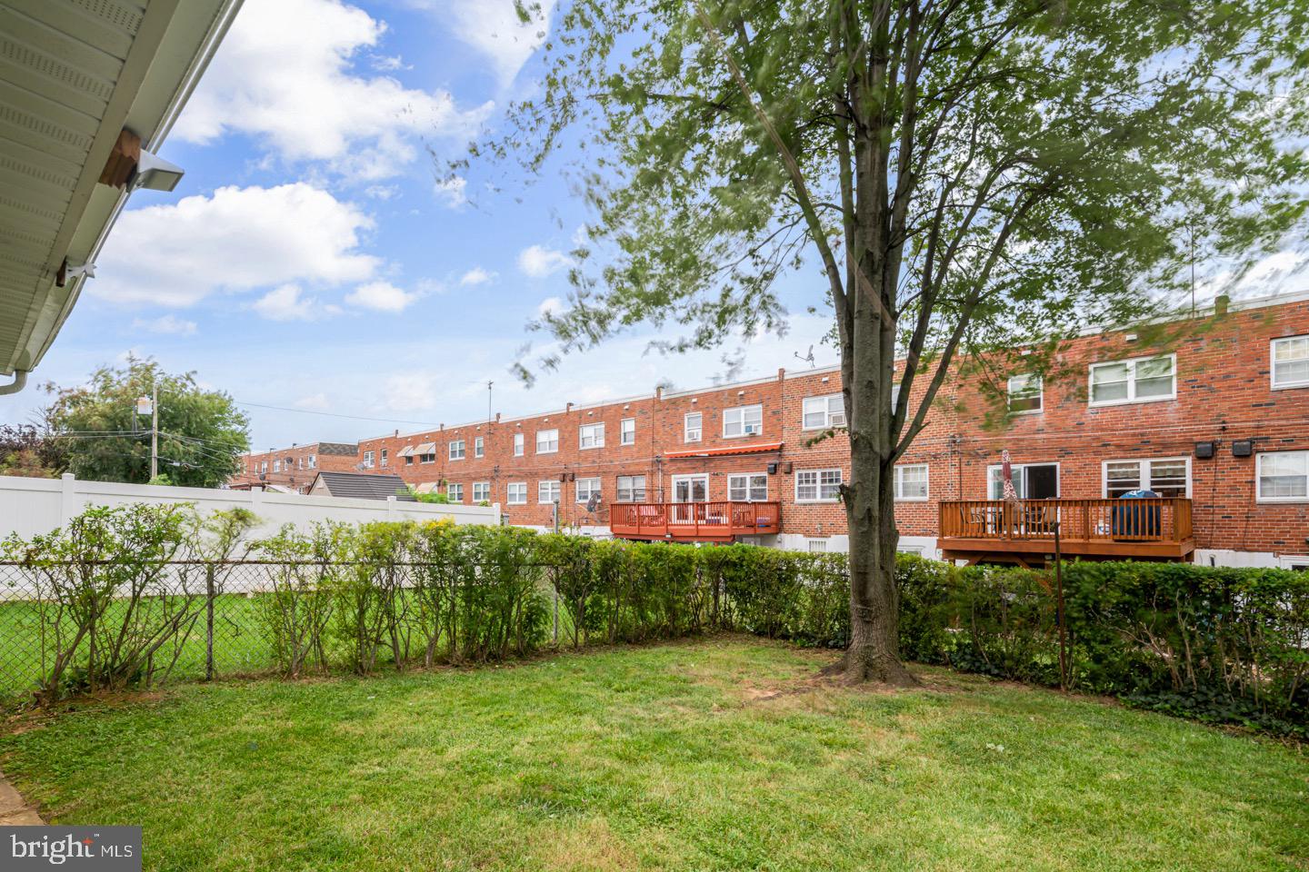 12482 Balston Road Philadelphia, PA 19154 - Photo 3 of 30 a view of a garden with a building in the background