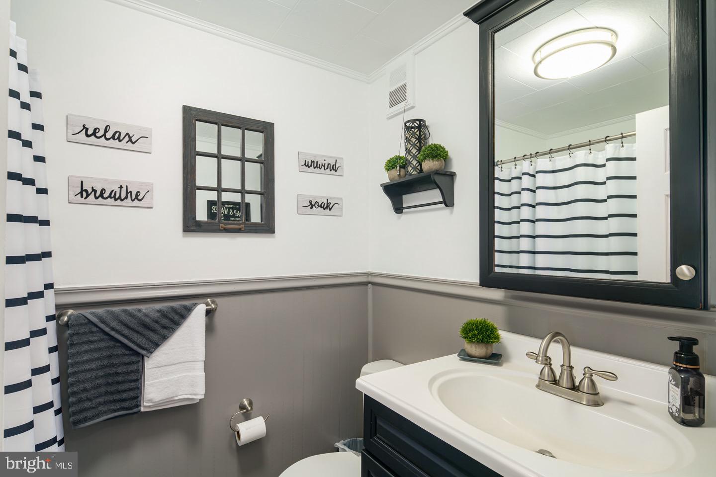 12482 Balston Road Philadelphia, PA 19154 - Photo 26 of 30 a bathroom with a sink and a mirror