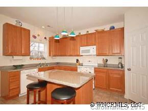 273 Wildbriar Road Fletcher, NC 28732 - Photo 7 of 11 a kitchen with a sink cabinets and window