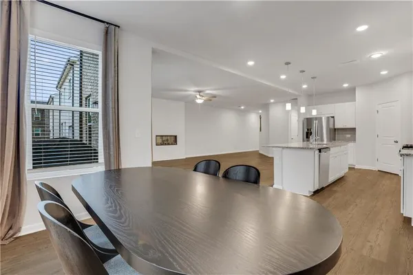 a view of kitchen and hall with a window