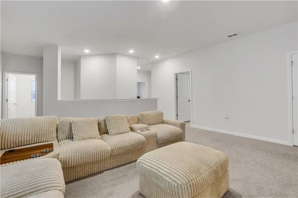 a living room with furniture and a couch