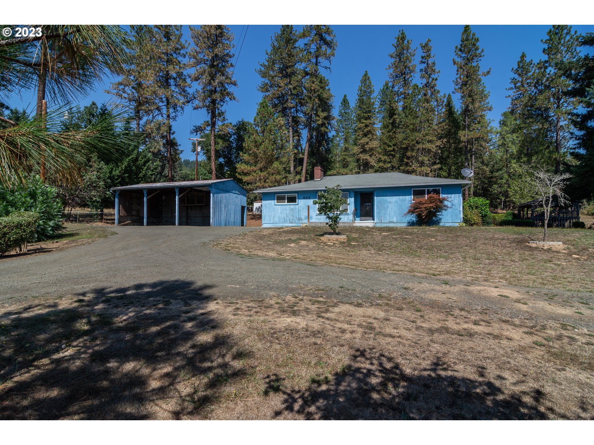 959 Doerner Road Roseburg, OR 97471 - Photo 2 of 40 a view of a house with a outdoor space