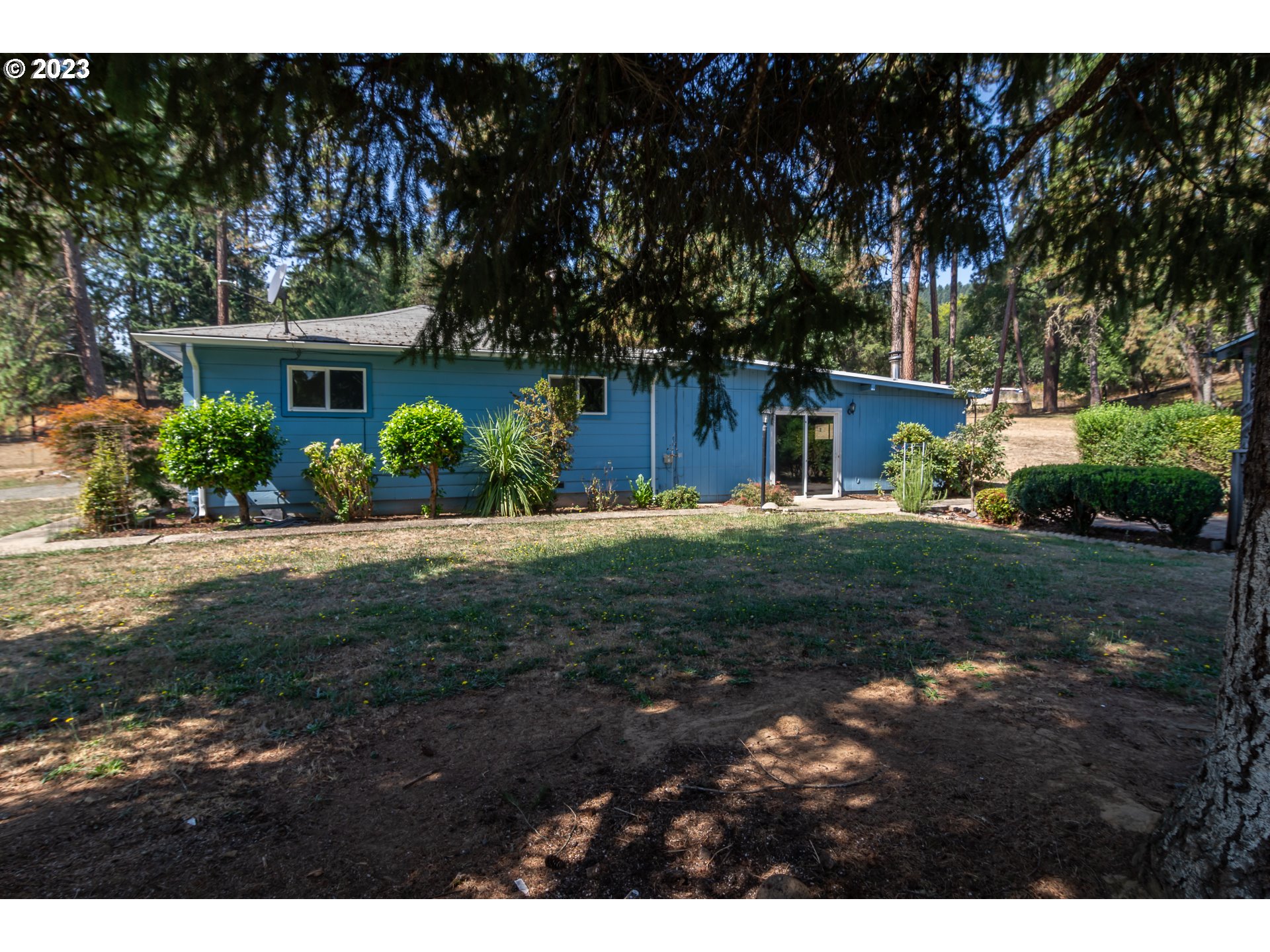 959 Doerner Road Roseburg, OR 97471 - Photo 6 of 40 a view of a garden with a house