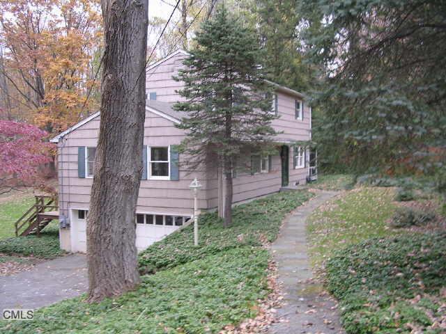 13 Hobby Drive Ridgefield, CT 06877 - Photo 1 of 1 a front view of a house with a garden