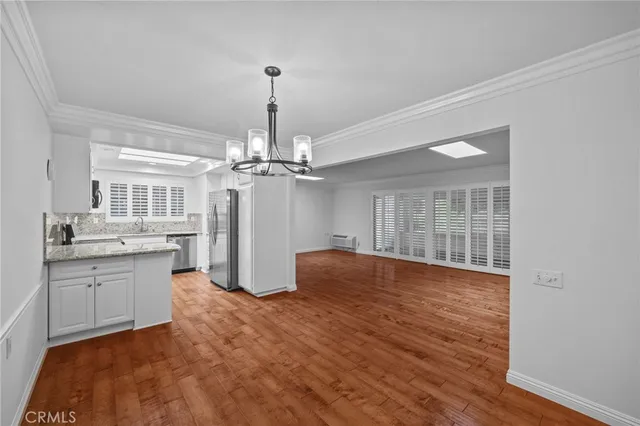a view of a kitchen with granite countertop furniture a sink and dishwasher