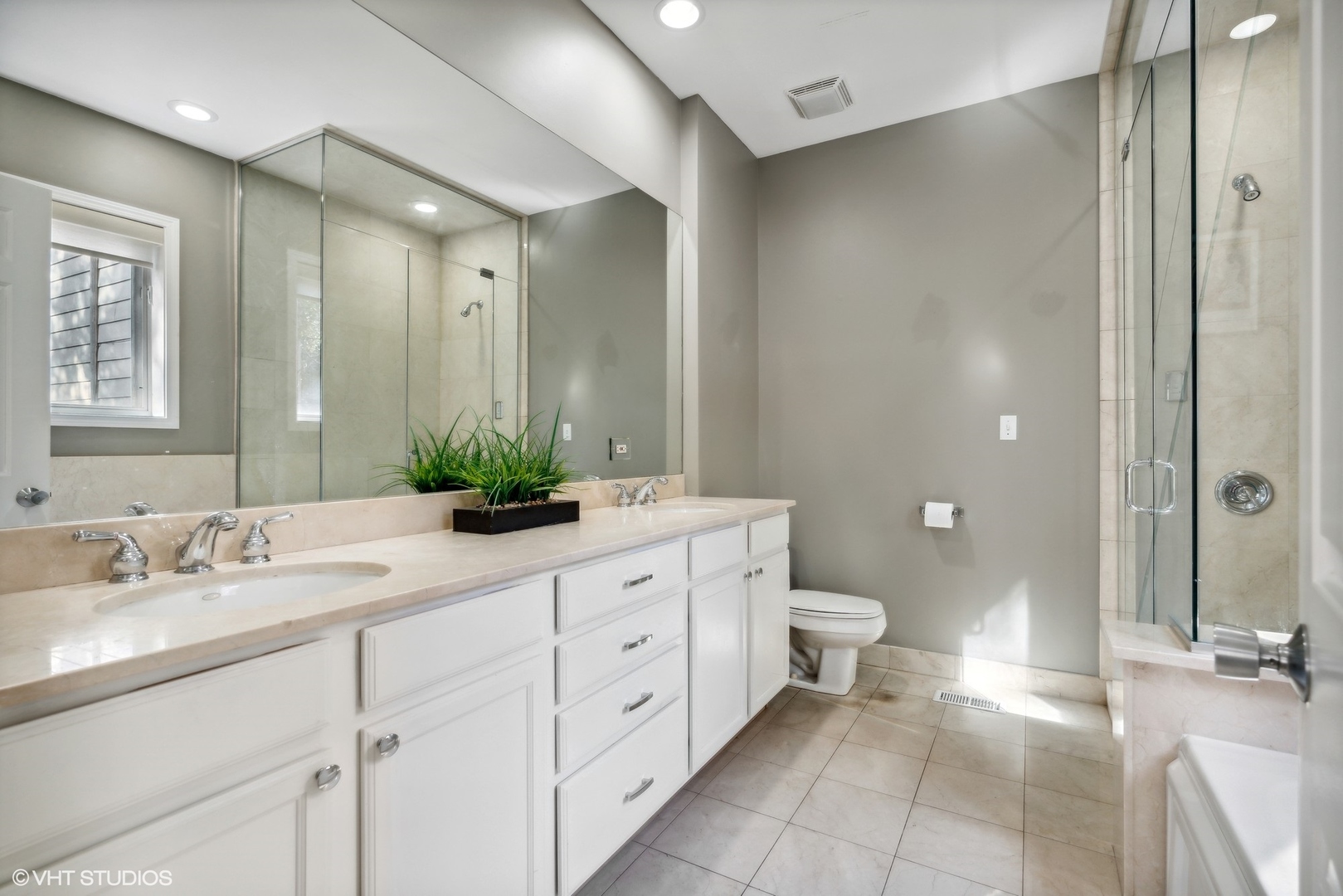3818 North Clark Street, Unit 1S Chicago, IL 60613 - Photo 11 of 22 a spacious bathroom with a double vanity sink toilet and shower