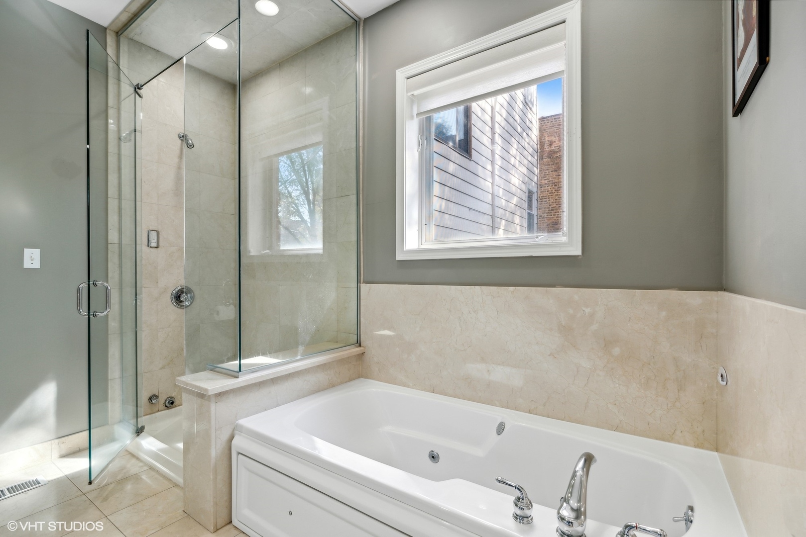 3818 North Clark Street, Unit 1S Chicago, IL 60613 - Photo 12 of 22 a bathroom with a bathtub and a shower