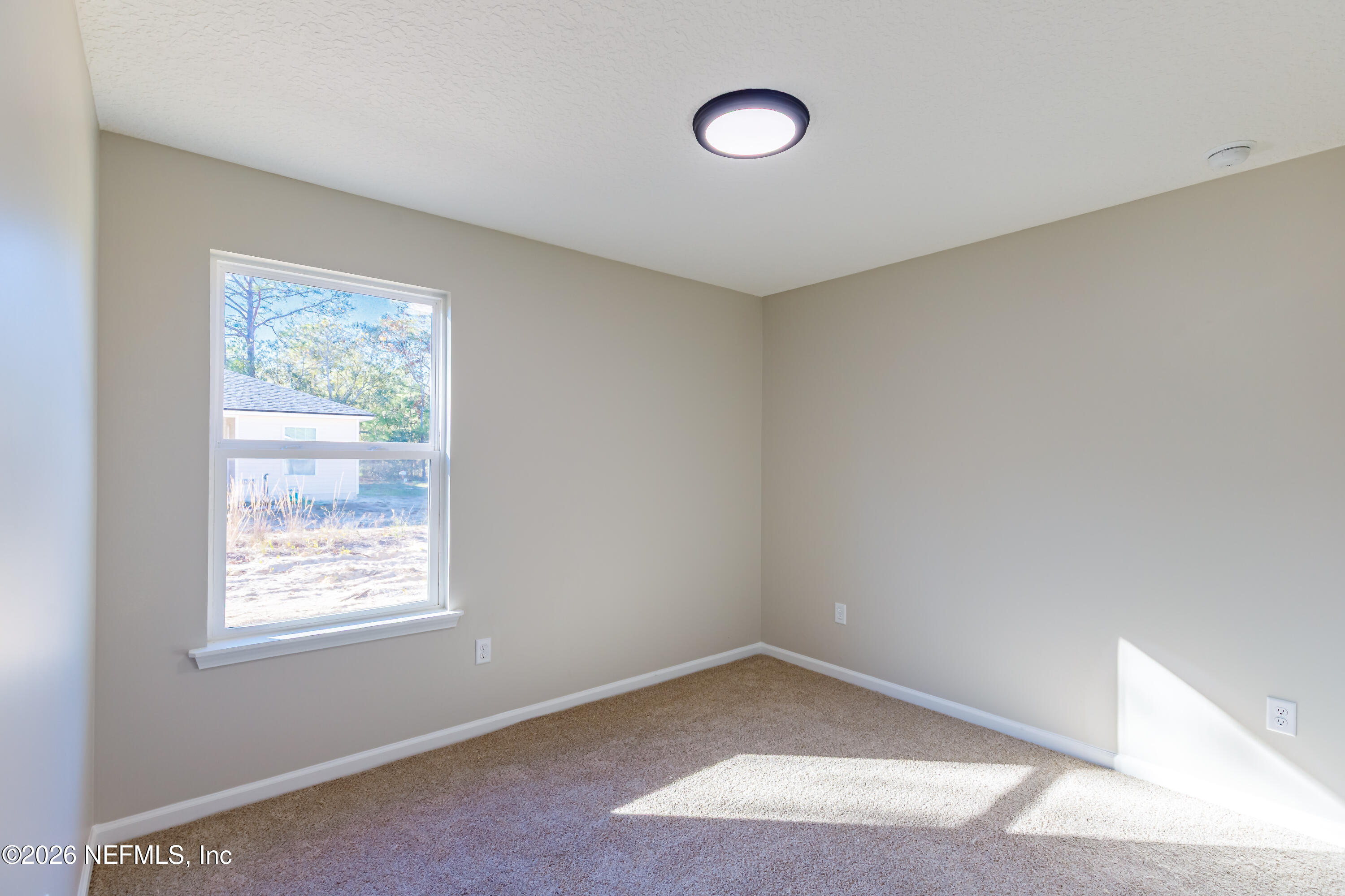 6202 Furman Avenue Keystone Heights, FL 32656 - Photo 21 of 24 an empty room with a window