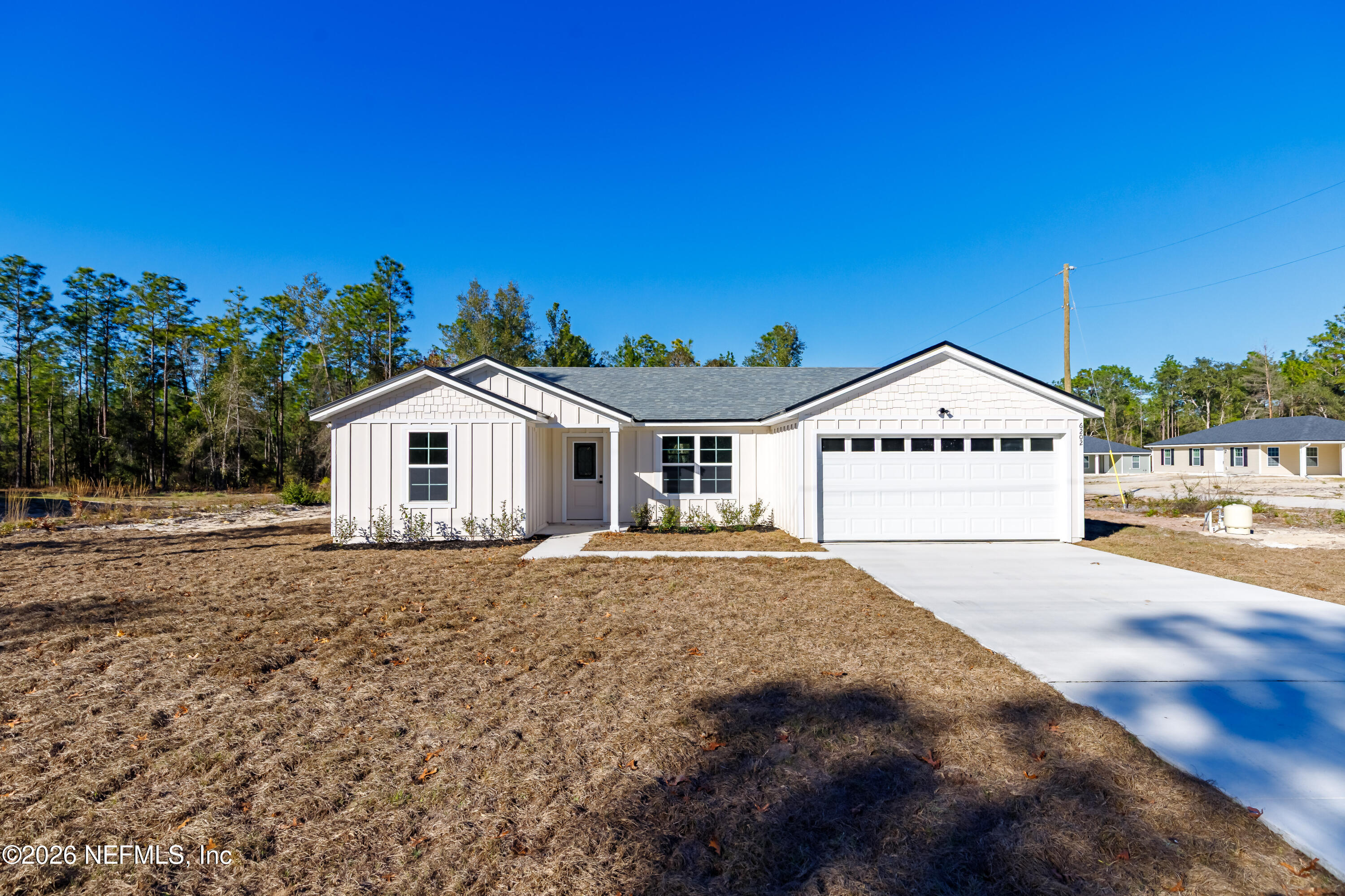 6202 Furman Avenue Keystone Heights, FL 32656 - Photo 3 of 24 a view of a white house with a yard