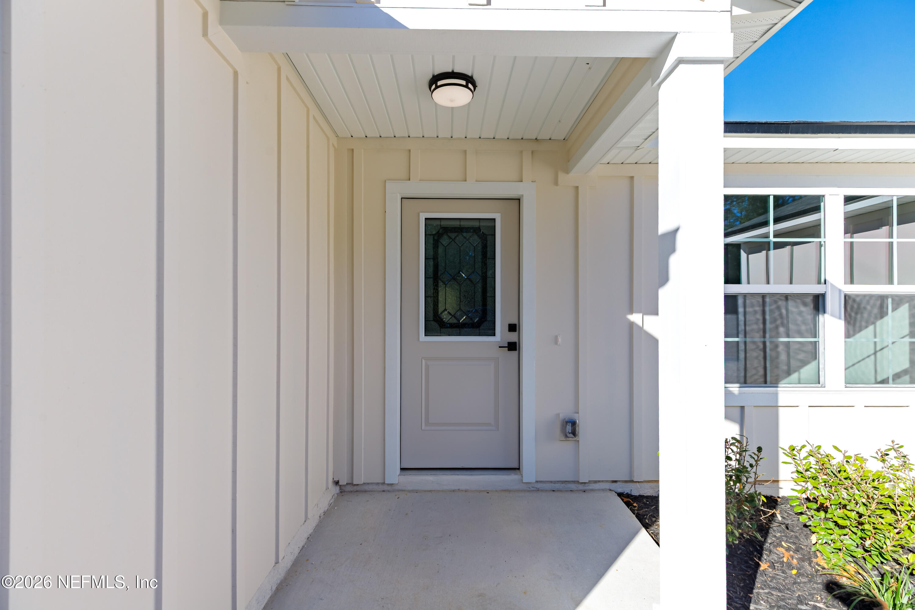 6202 Furman Avenue Keystone Heights, FL 32656 - Photo 4 of 20 a view of a hallway with wooden floor and entryway