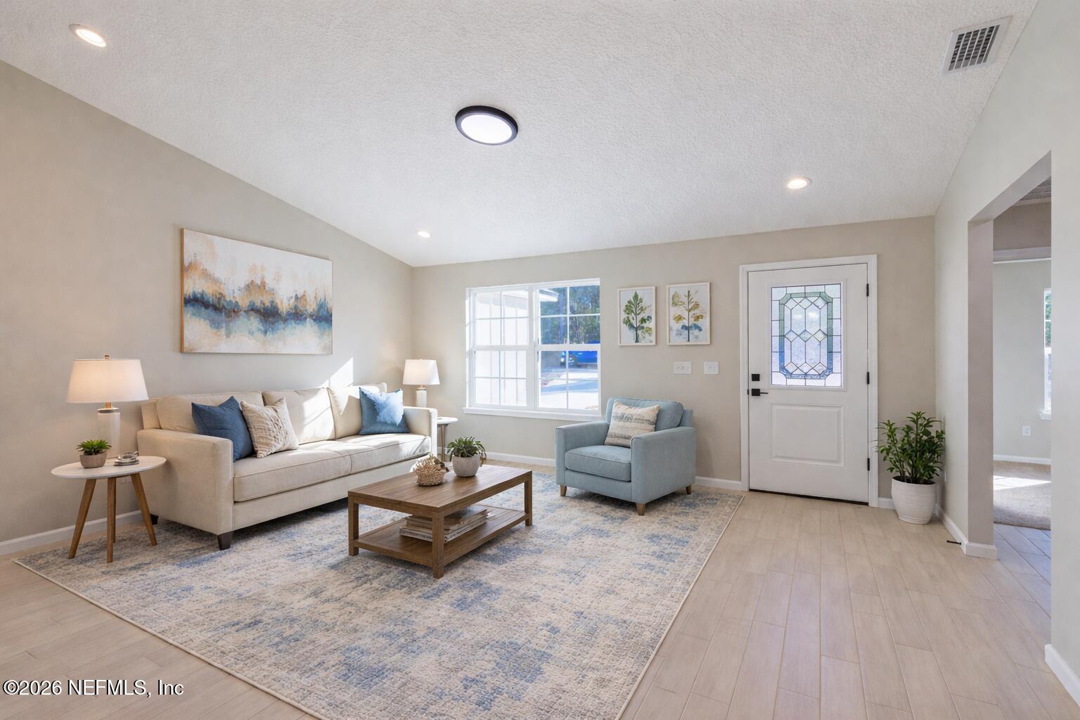 6202 Furman Avenue Keystone Heights, FL 32656 - Photo 6 of 24 a living room with furniture and a flat screen tv
