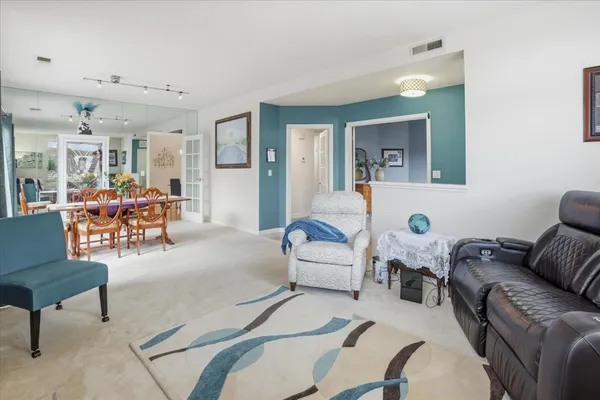 a living room with furniture and a table