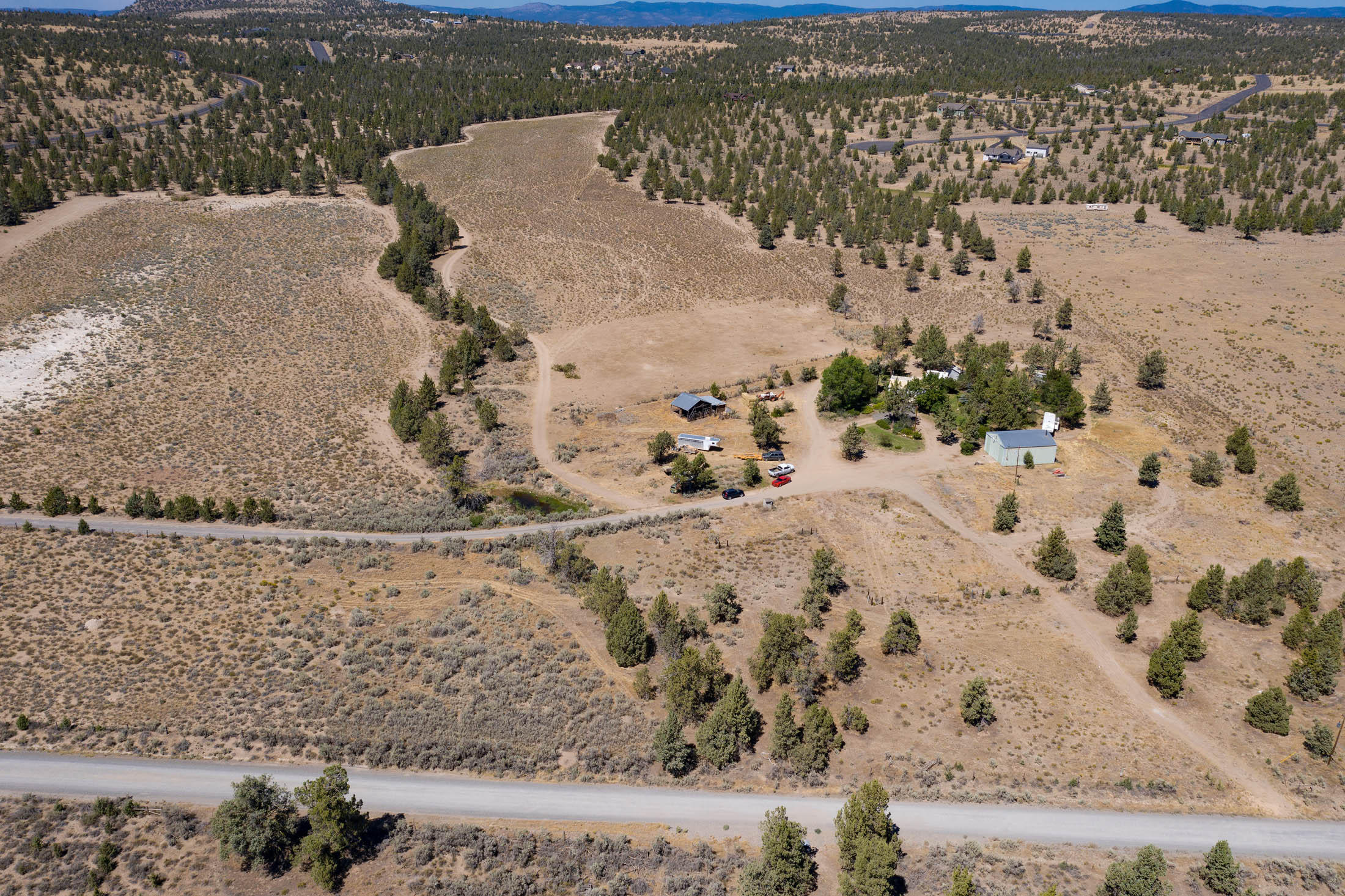 Maphet Rd in foreground, driveway on the right,