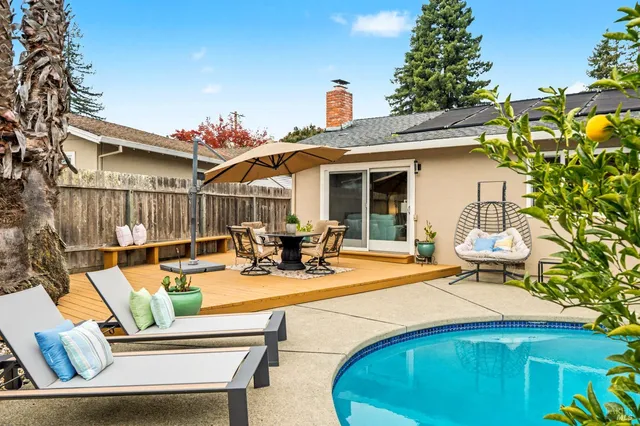 a view of a patio with swimming pool
