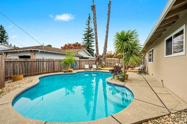 a view of a swimming pool with sitting area