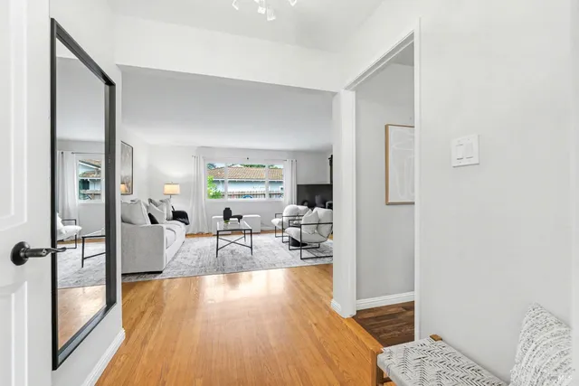a living room with furniture and a table