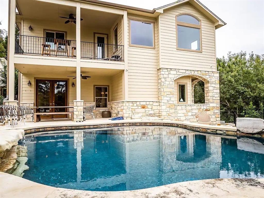 16308 Lake Loop Austin, TX 78734 - Photo 1 of 1 a swimming pool view with a outdoor seating