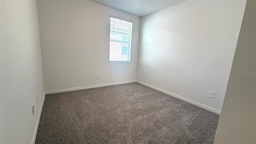 4543 Sidesaddle Trail St. Cloud, FL 34772 - Photo 12 of 19 an empty room with a window