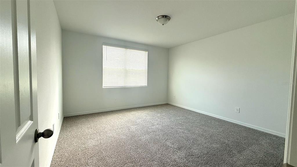 4543 Sidesaddle Trail St. Cloud, FL 34772 - Photo 15 of 19 an empty room with windows