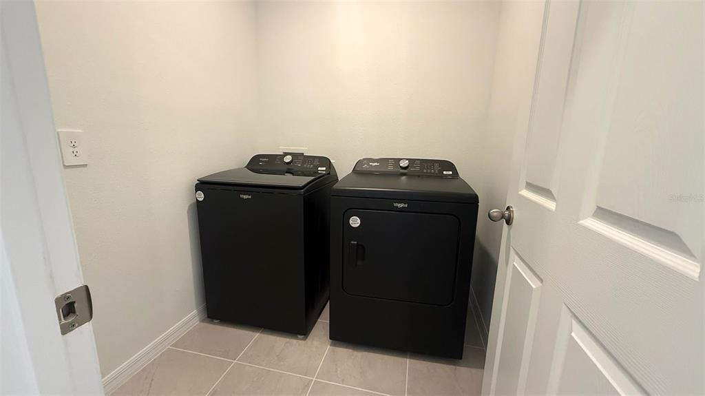 4543 Sidesaddle Trail St. Cloud, FL 34772 - Photo 16 of 19 a view of washer and dryer