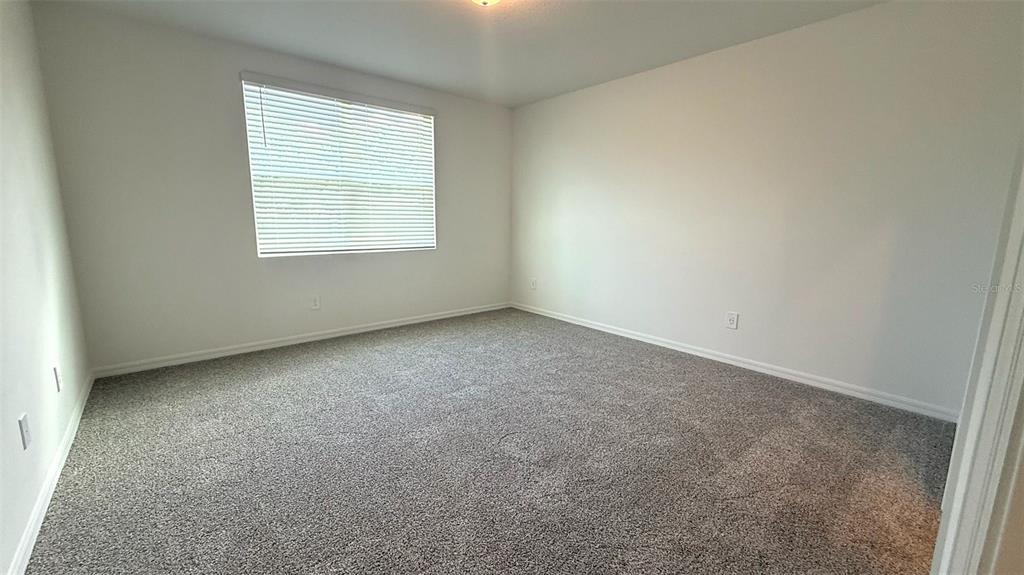 4543 Sidesaddle Trail St. Cloud, FL 34772 - Photo 8 of 19 an empty room with a window