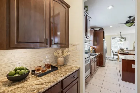 a kitchen with stainless steel appliances granite countertop a sink and cabinets