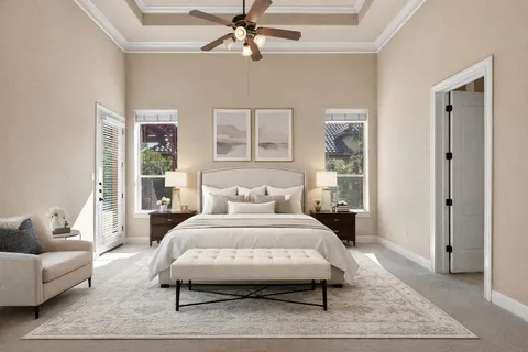 a bedroom with a bed a rug and a couch