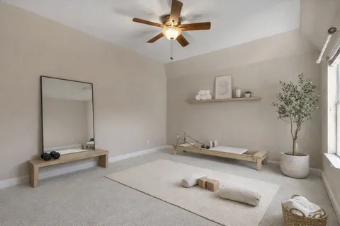 a room with a table and a potted plant