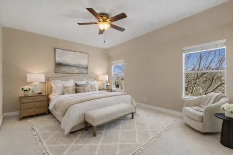 a bedroom with a bed and a couch