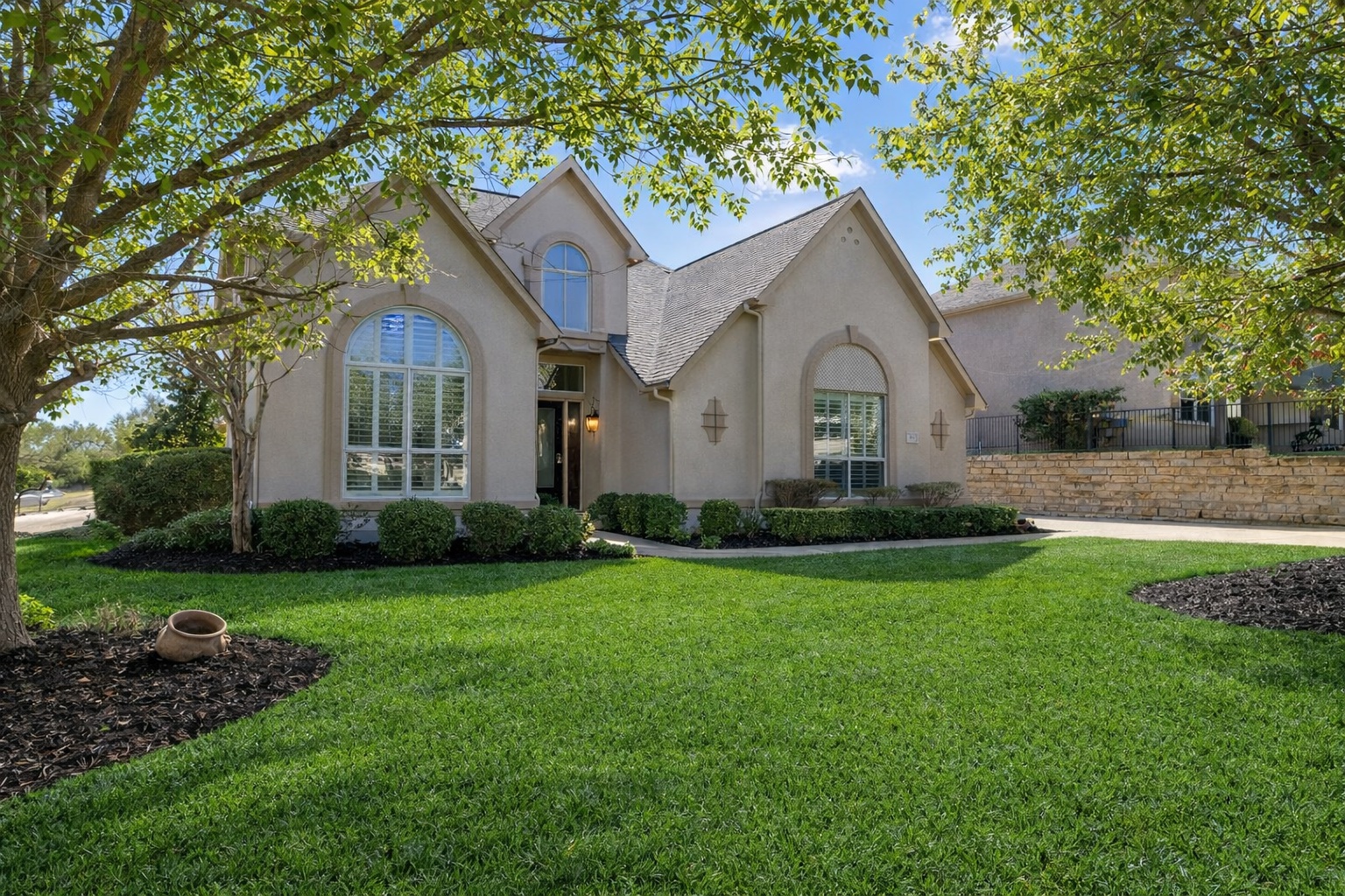 111 Whitley Drive Austin, TX 78738 - Photo 3 of 38 a front view of a house with garden