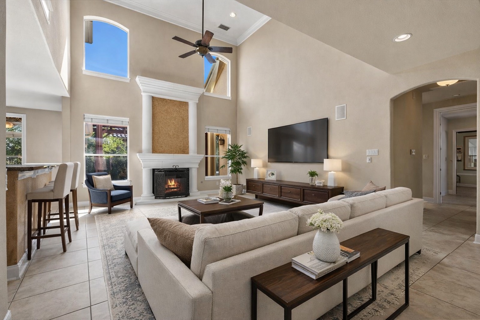 111 Whitley Drive Austin, TX 78738 - Photo 7 of 38 a living room with furniture a fireplace and a flat screen tv