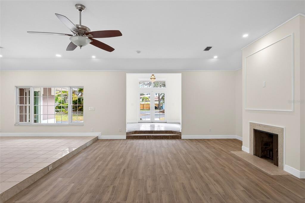 7108 Midnight Pass Road Sarasota, FL 34242 - Photo 13 of 83 a view of an empty room with wooden floor and a window