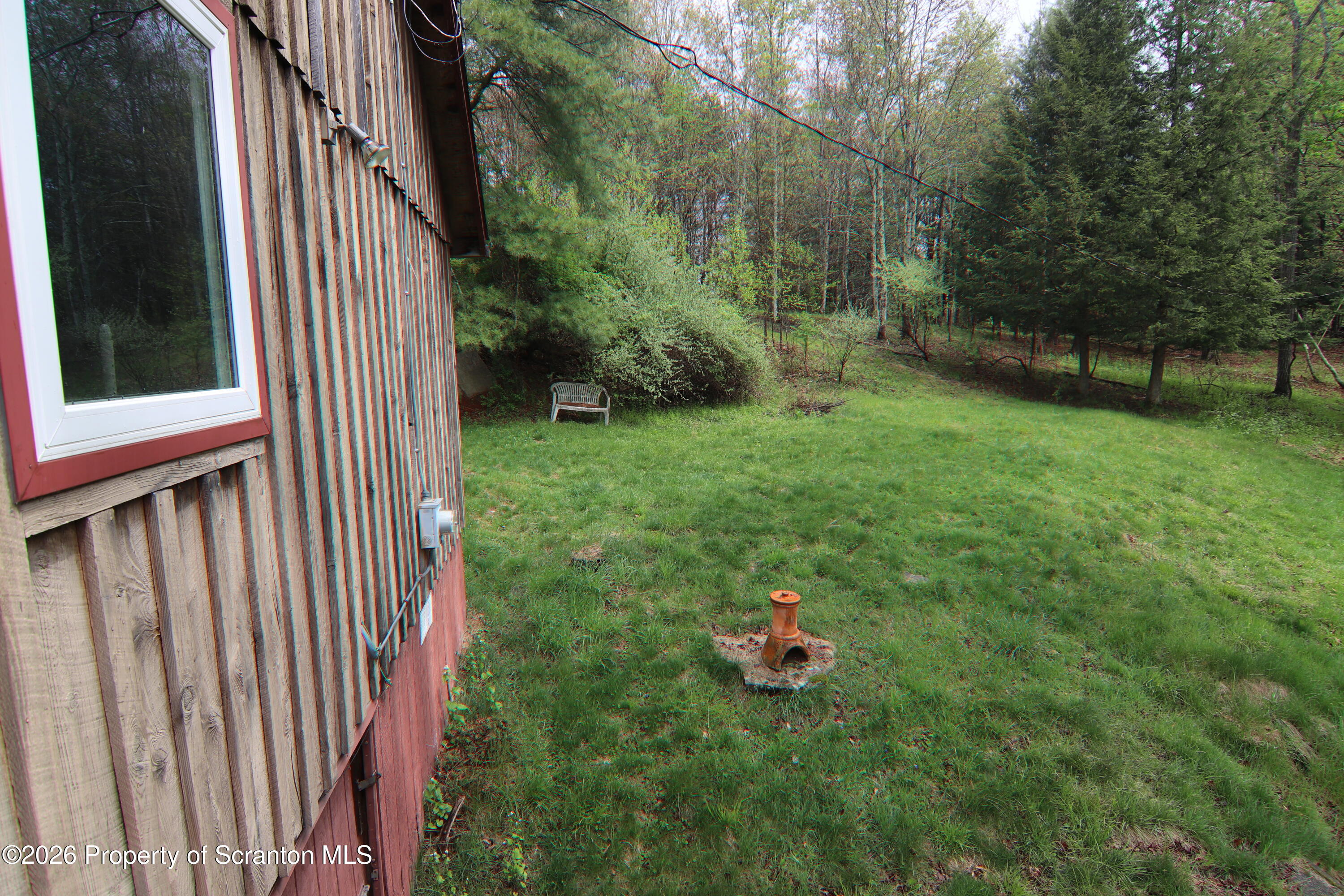 300 Pennsworth Hill Road Meshoppen, PA 18630 - Photo 31 of 38 a view of a backyard with plants and large trees