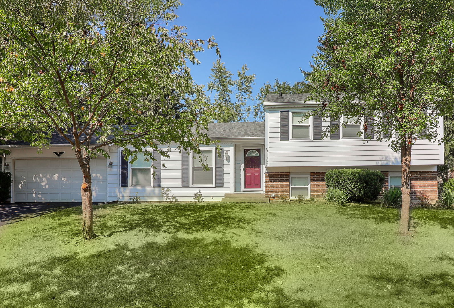 307 Cedarbrook Road Naperville, IL 60565 - Photo 1 of 25 front view of a house with a yard