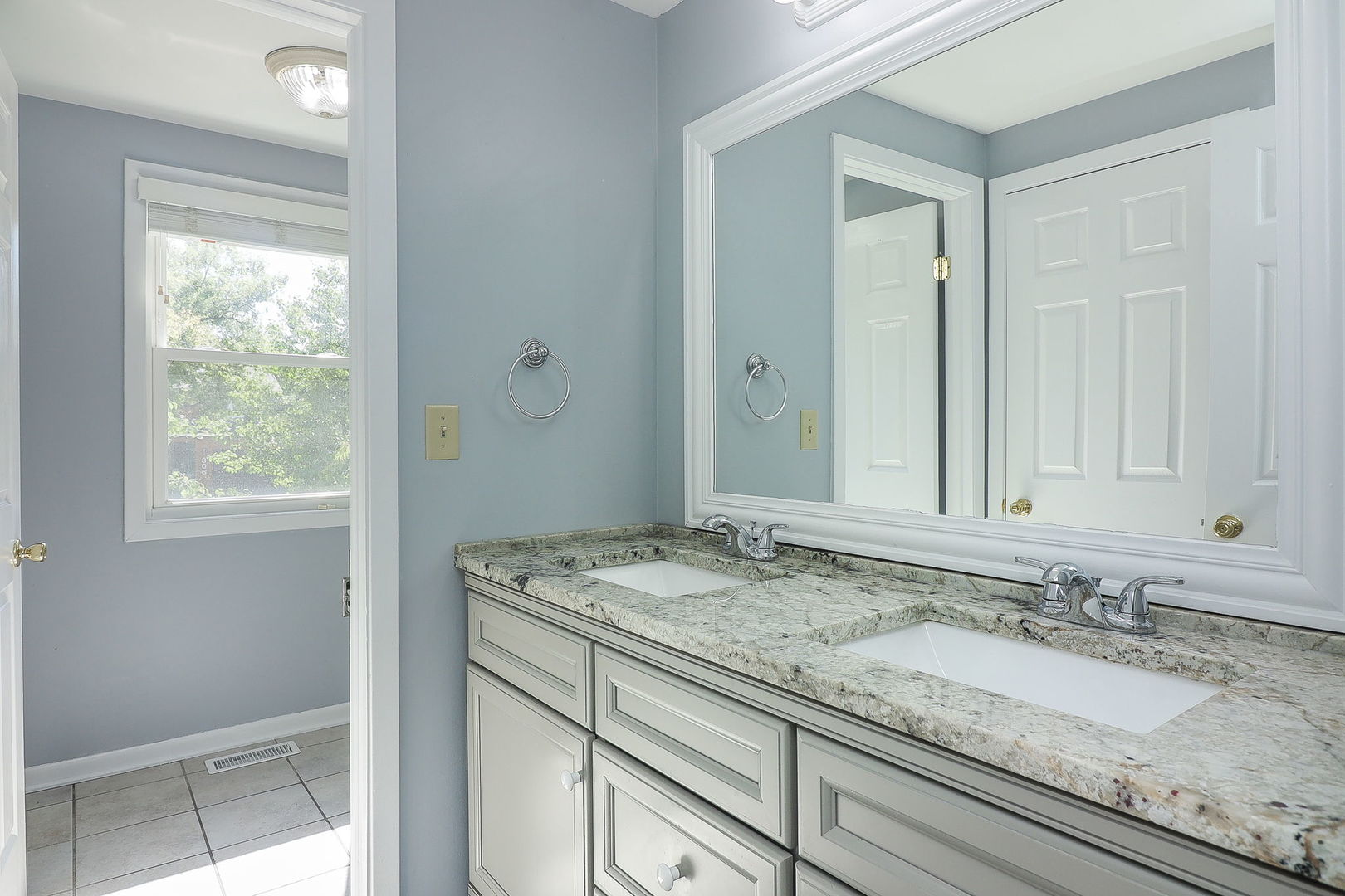 307 Cedarbrook Road Naperville, IL 60565 - Photo 16 of 25 a bathroom with a granite countertop sink and a mirror