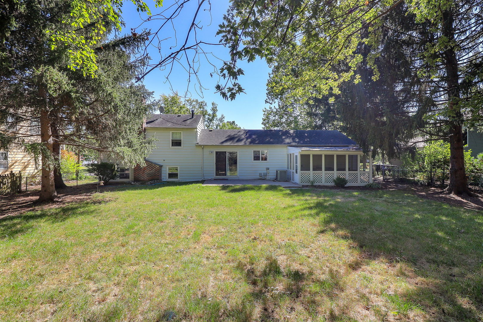 307 Cedarbrook Road Naperville, IL 60565 - Photo 22 of 25 a front view of a house with garden