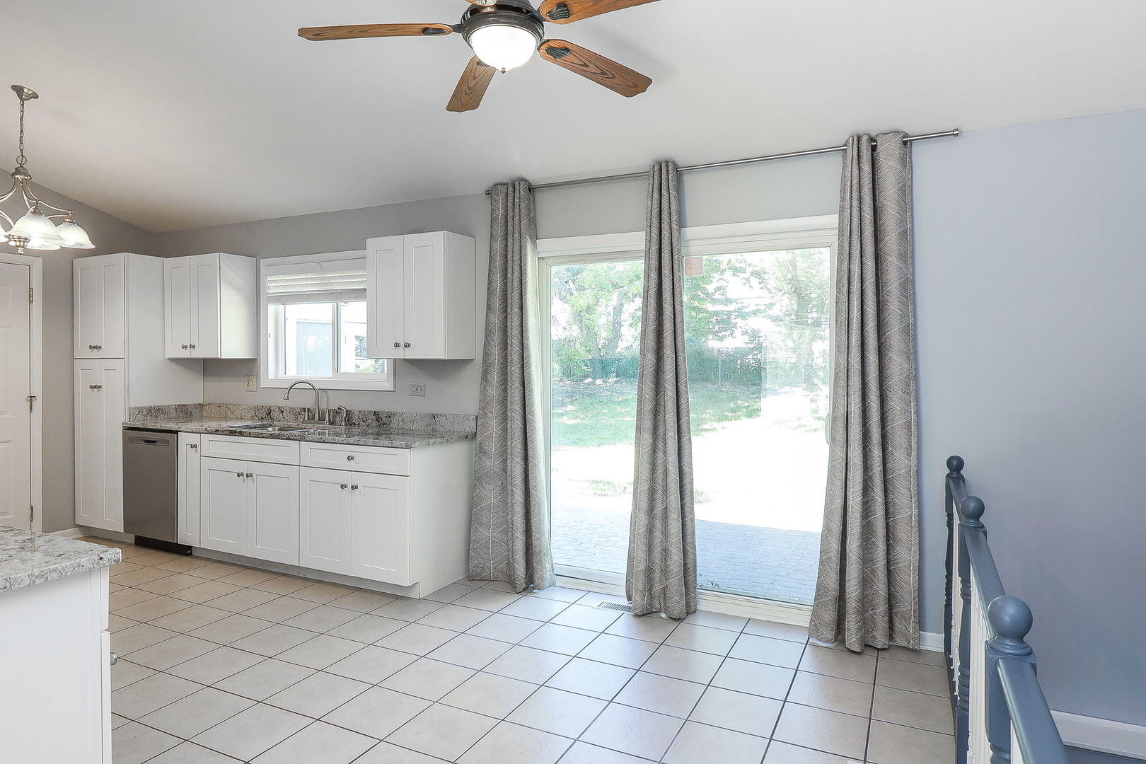 307 Cedarbrook Road Naperville, IL 60565 - Photo 8 of 25 a view of a kitchen with a sink and a window