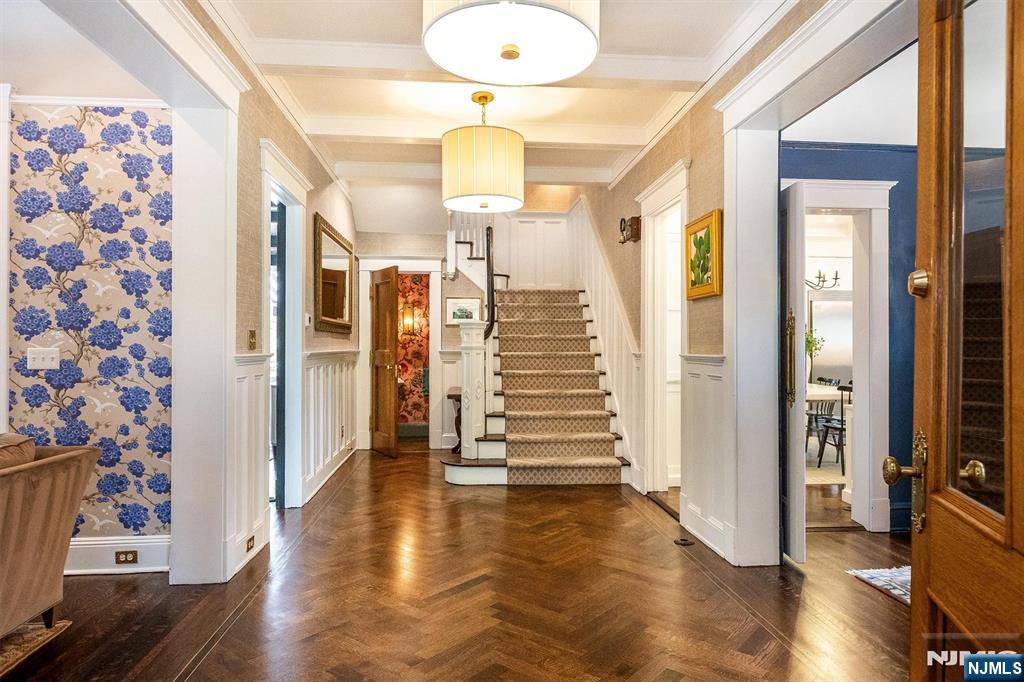 380 Ridgewood Avenue Glen Ridge, NJ 07028 - Photo 6 of 50 a view of a hallway with wooden floor and entryway