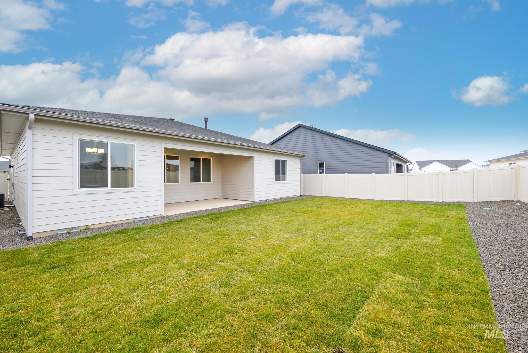 1940 West Chokecherry Avenue Middleton, ID 83644 - Photo 12 of 12 Back of house featuring a patio and a fenced backyard