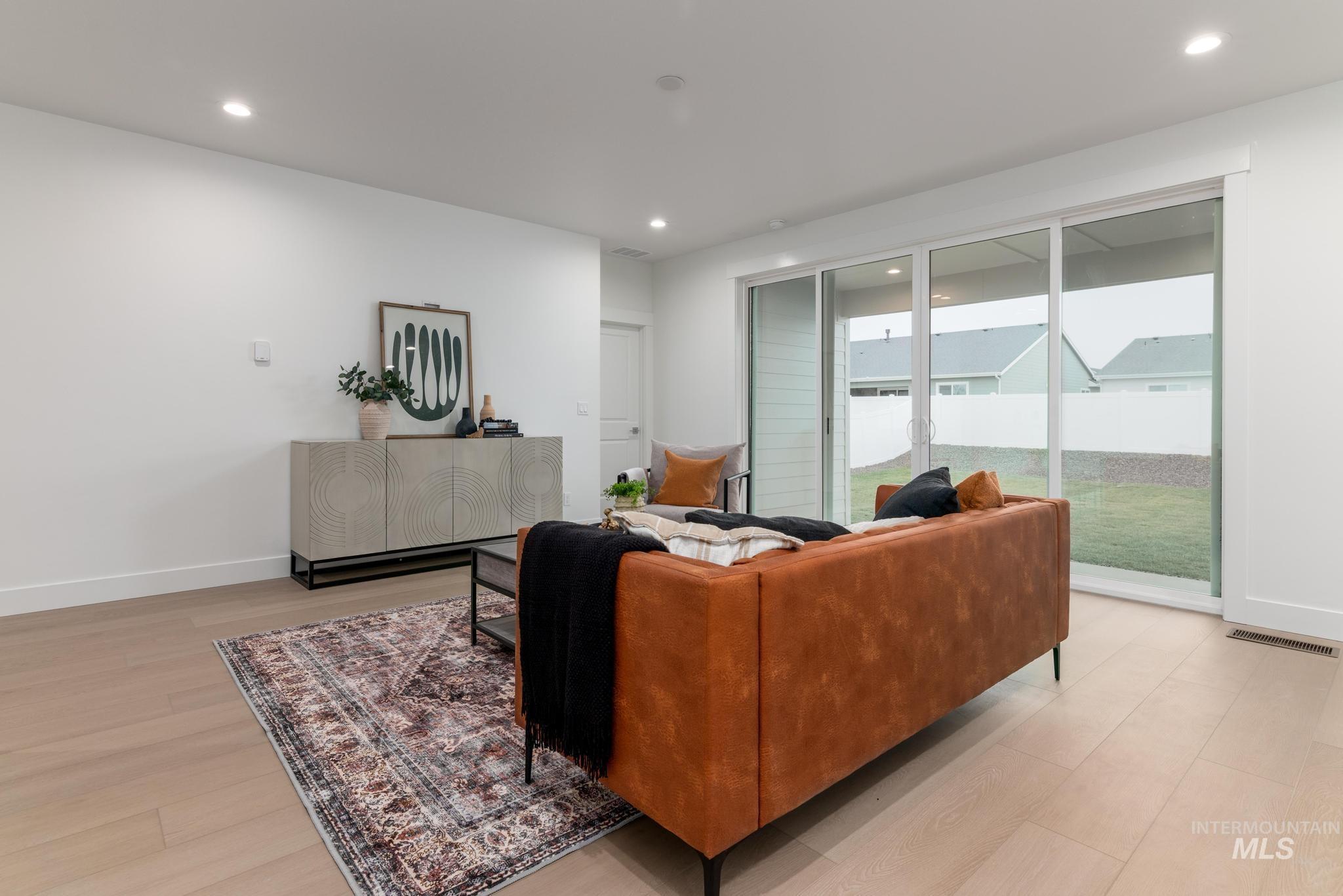 1940 West Chokecherry Avenue Middleton, ID 83644 - Photo 2 of 12 Living area featuring recessed lighting and light wood-type flooring