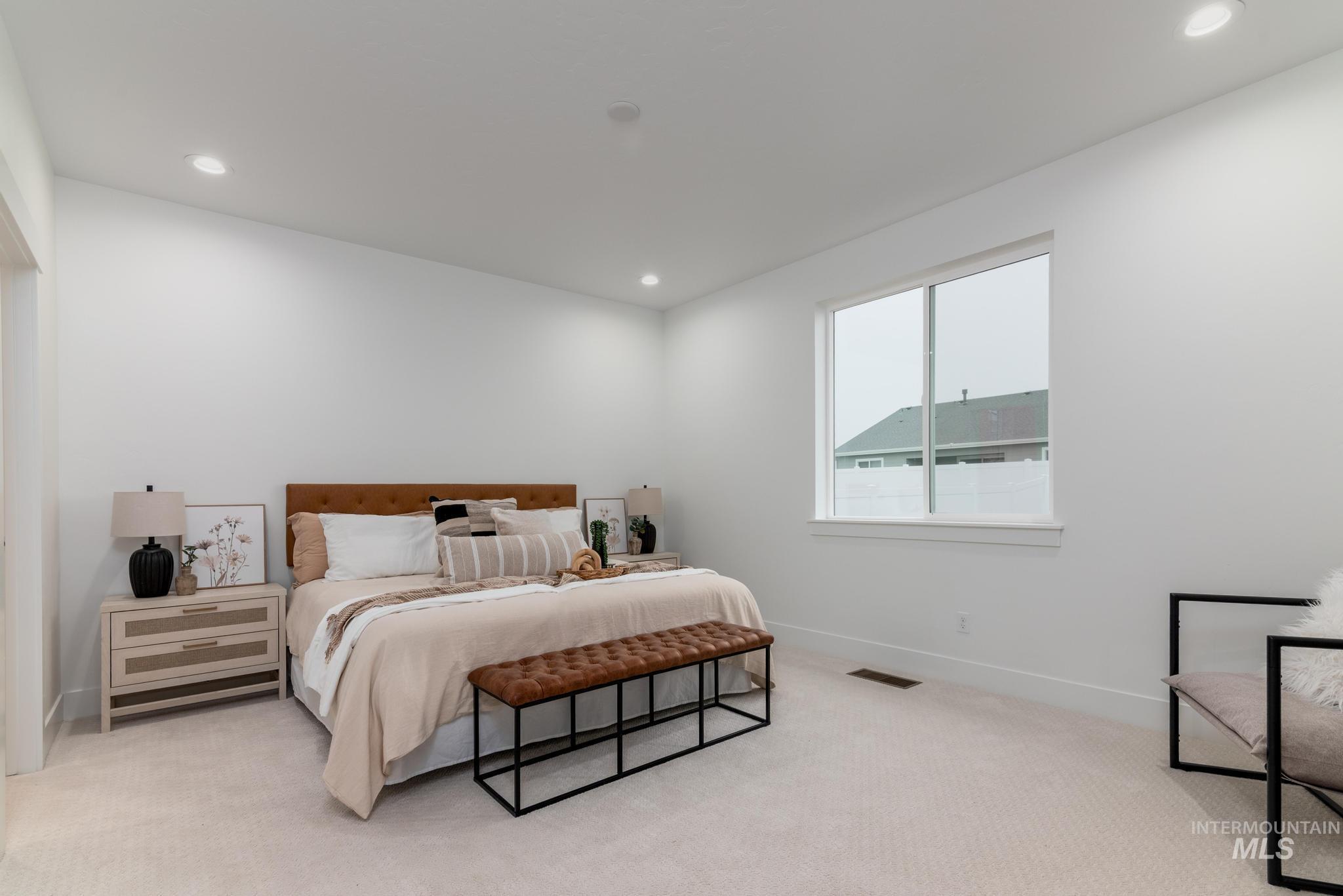 1940 West Chokecherry Avenue Middleton, ID 83644 - Photo 8 of 12 Bedroom with light colored carpet and recessed lighting