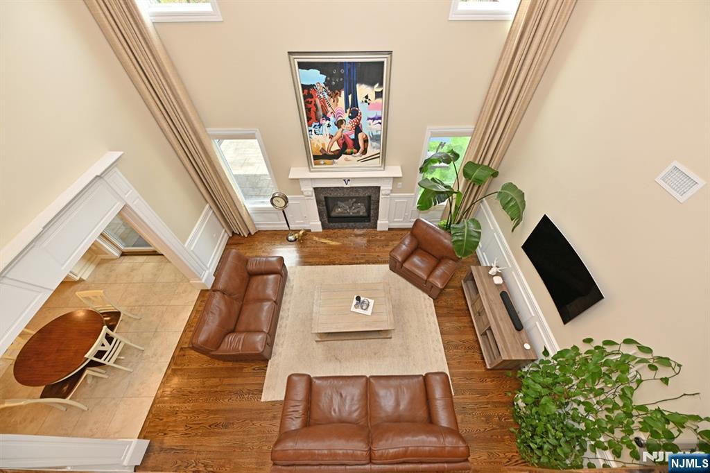 106 Arnot Place Paramus, NJ 07652 - Photo 13 of 48 a living room with furniture and a fireplace