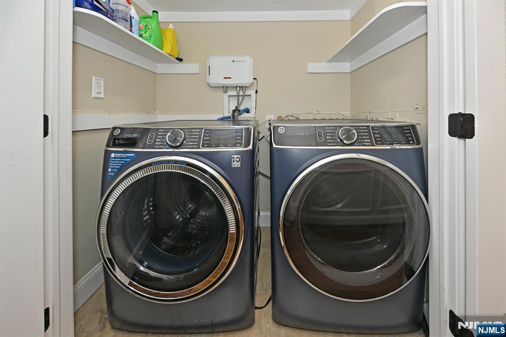 106 Arnot Place Paramus, NJ 07652 - Photo 19 of 48 a close up view of a washer and dryer