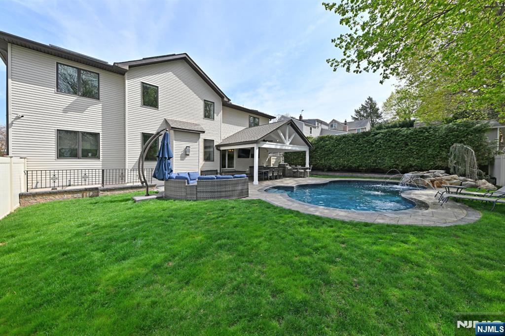 106 Arnot Place Paramus, NJ 07652 - Photo 33 of 48 a front view of house with yard and outdoor seating