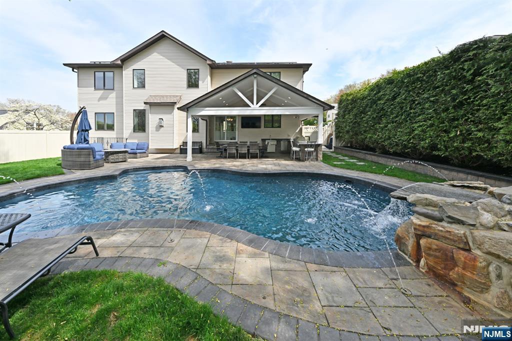 106 Arnot Place Paramus, NJ 07652 - Photo 35 of 48 a front view of a house with garden
